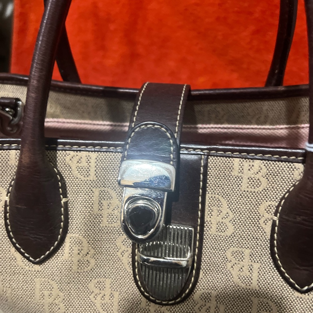 Dooney Bourke EUC with handle and shoulder strap.